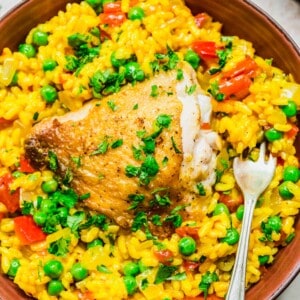 Overhead view of arroz con pollo in bowl with fork
