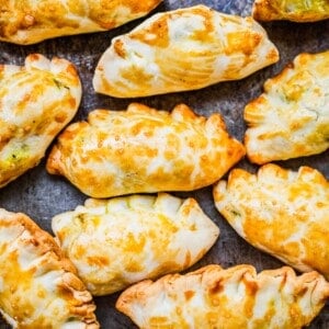 Overhead view of baked Chinese curry pockets on sheet pan