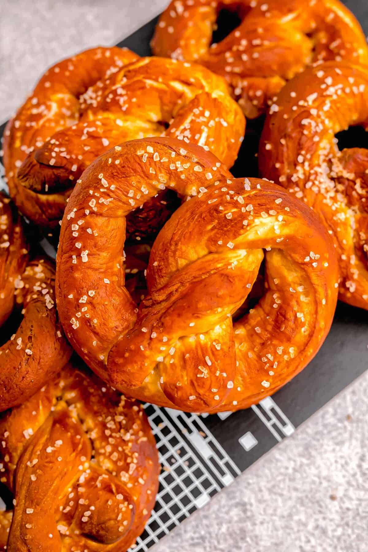 fresh baked browned homemade soft pretzels with salt sprinkled on top