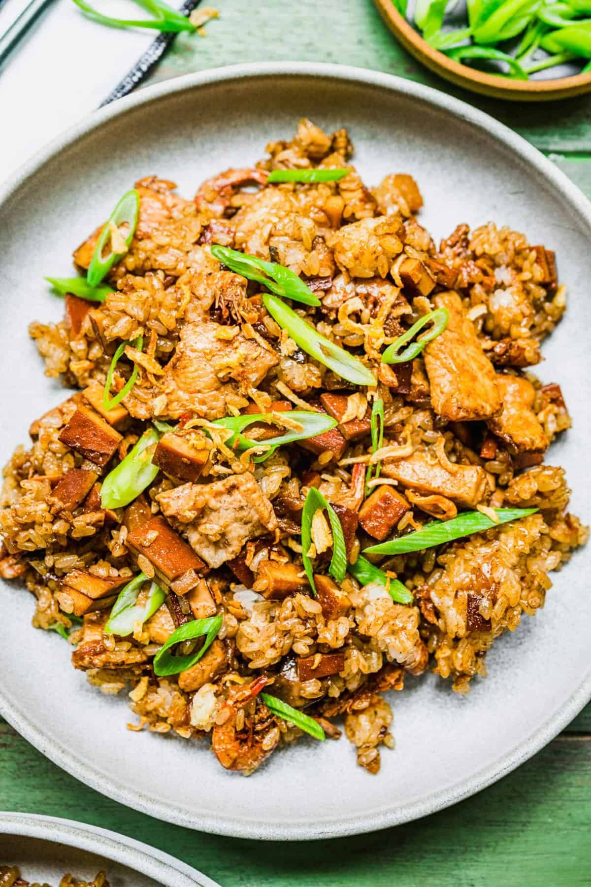 Plate of sticky rice garnished with scallions