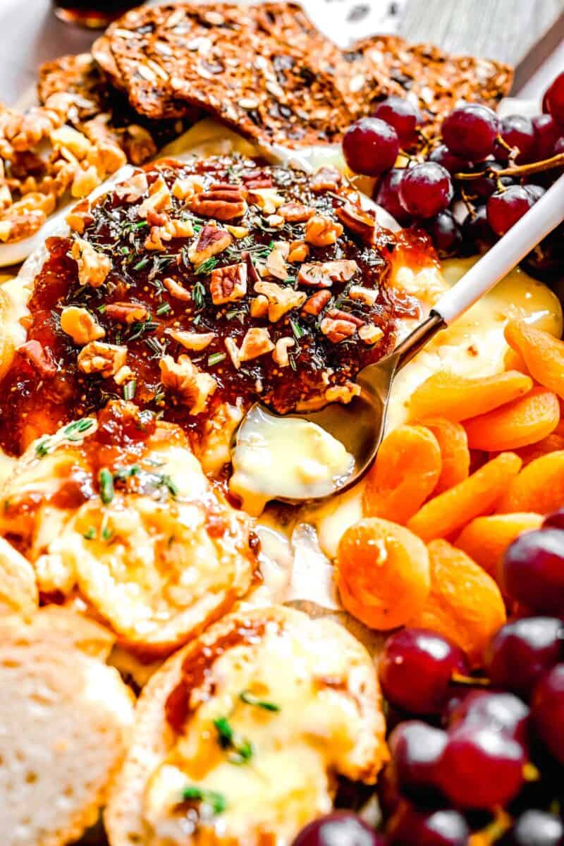 an image of melted center of baked brie on a spoon