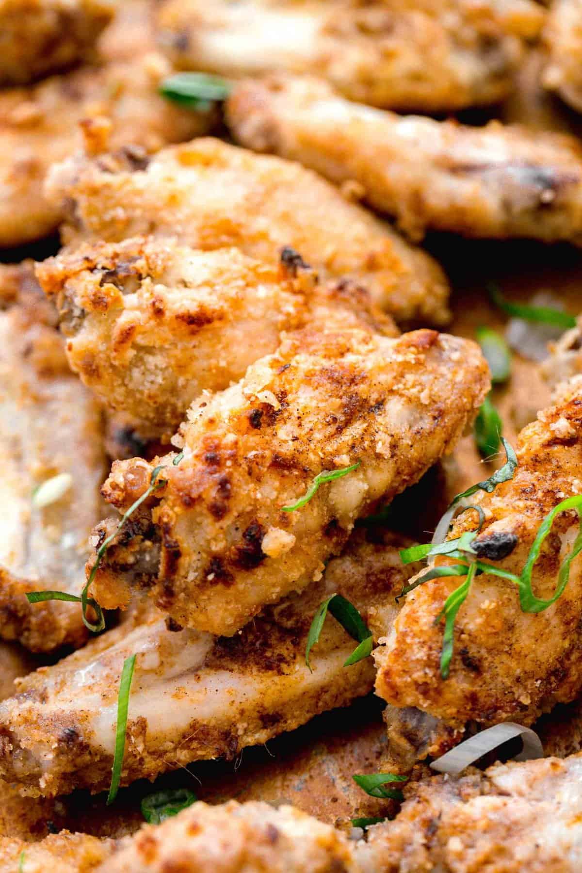 up close shot of a chinese salt and pepper chicken flat wing to show crispy crust.