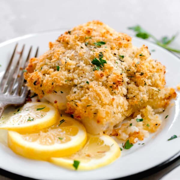 up close image of panko parmesan crust on cooked cod dat is browned on top