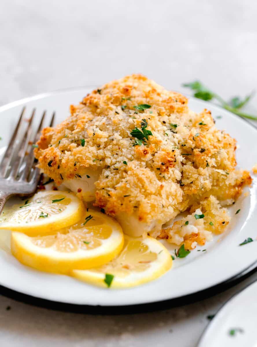up close image of panko parmesan crust on cooked cod that is browned on top