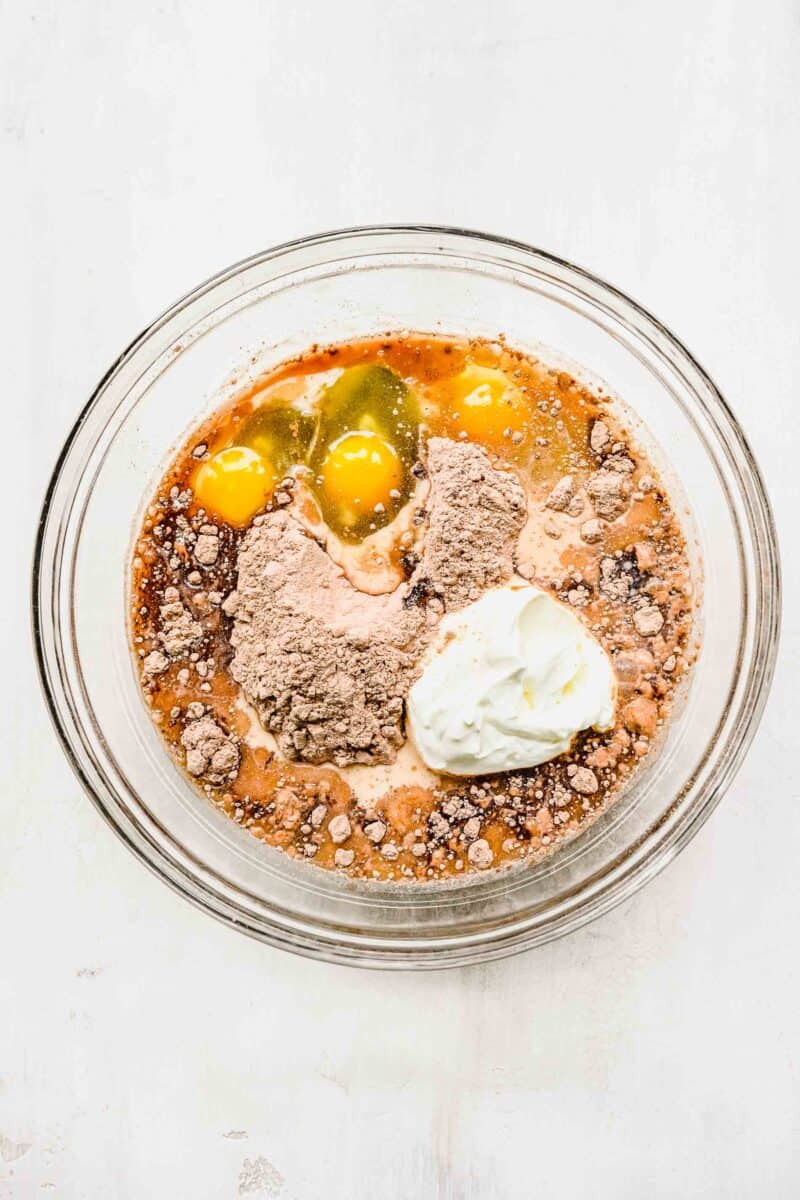 batter for chocolate pudding cake in a clear bowl