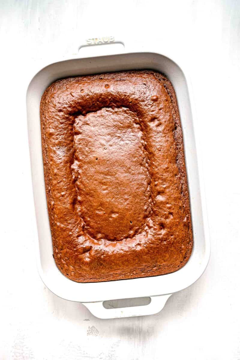 base of chocolate pudding cake in a white baking dish