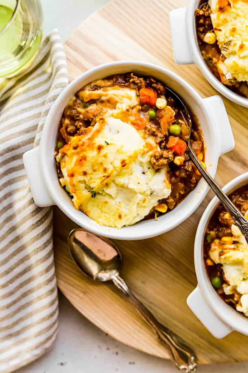 a single serving of shepherd's pie is placed in a white bowl.