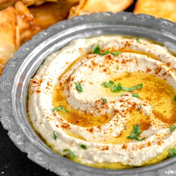 parsley, olive oil and cayenne pepper garnish a bowl of Baba Ganoush.