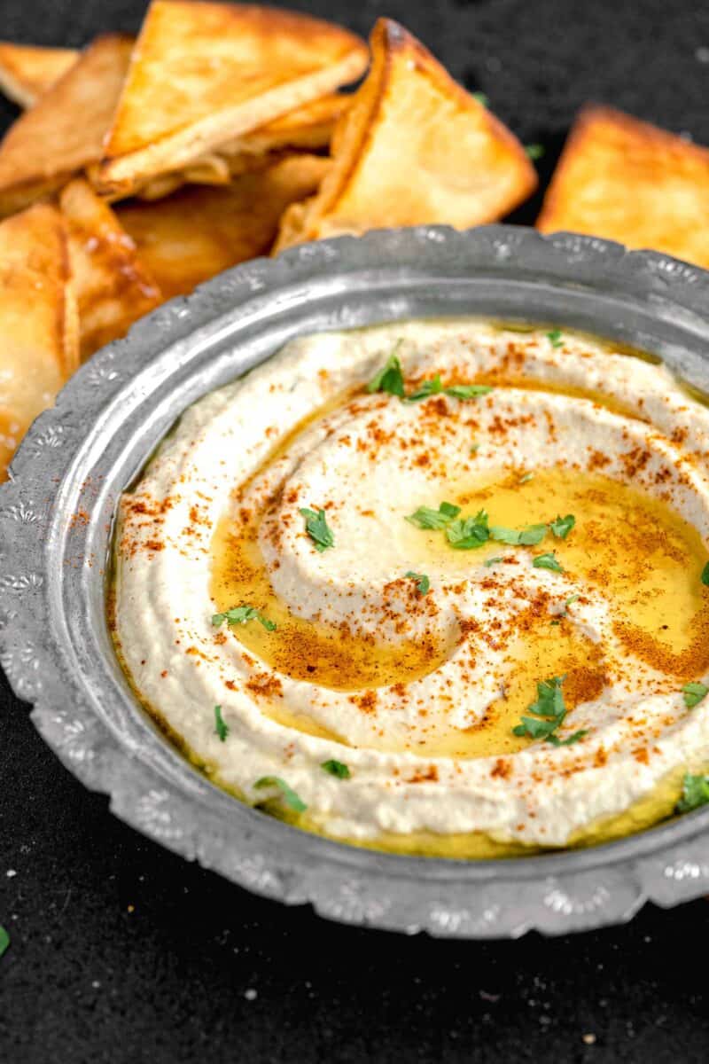 parsley, olive oil and cayenne pepper garnish a bowl of Baba Ganoush.