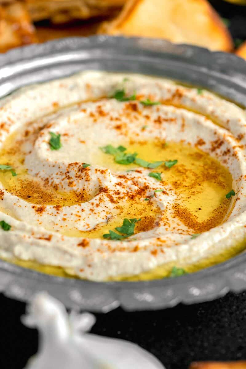 olive oil is lightly pooled atop a serving of Baba Ganoush.