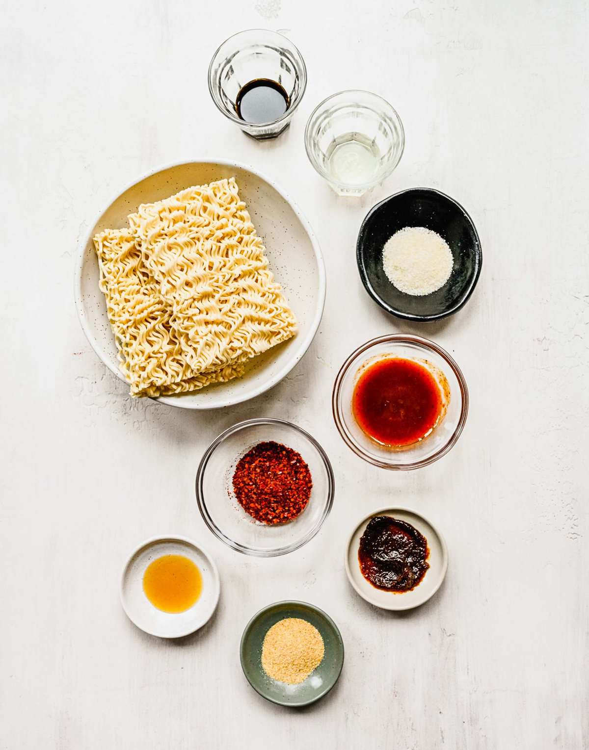 Ingredients for buldak ramen arranged in seperate bowls.