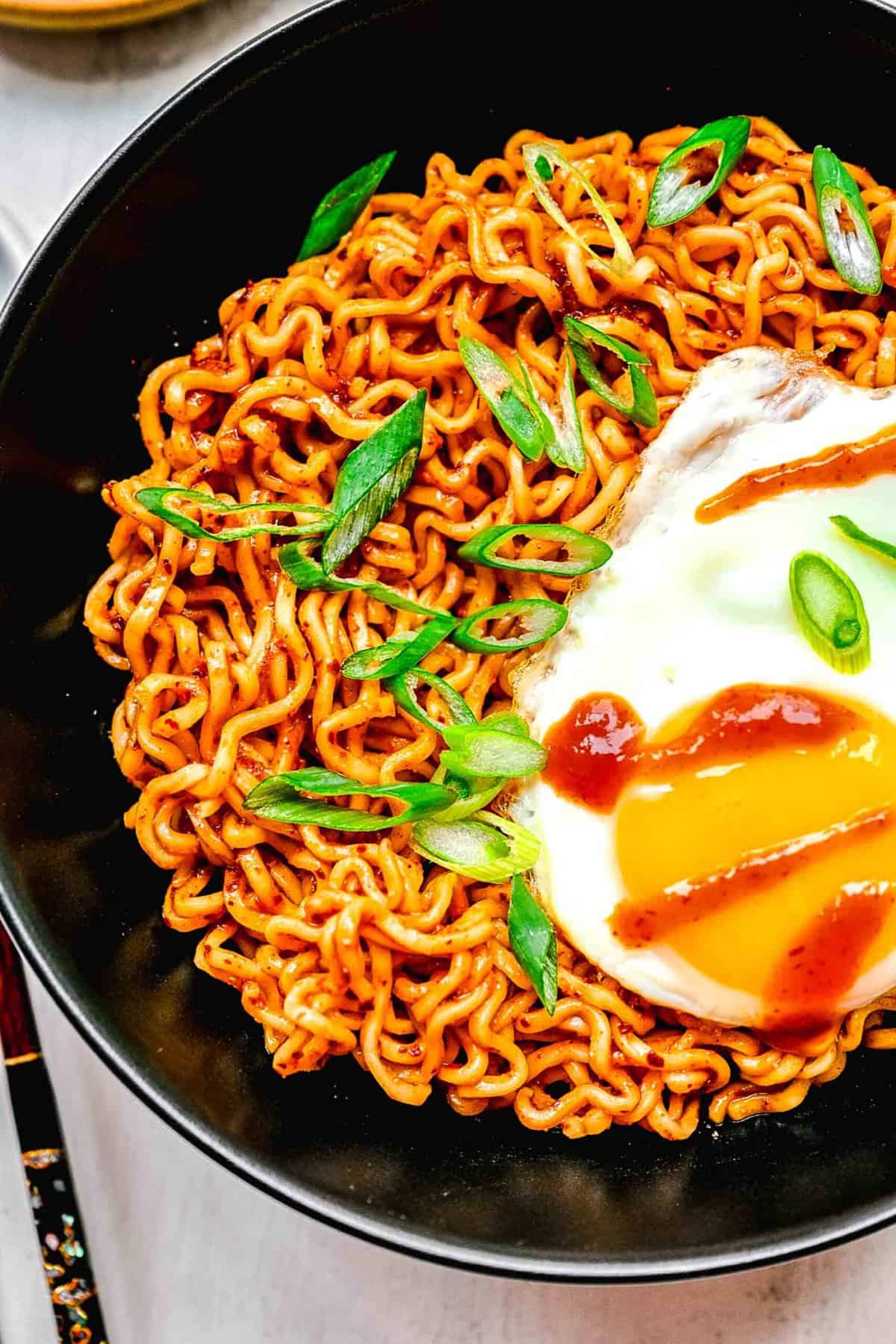 Buldak ramen served in a bowl with an egg.