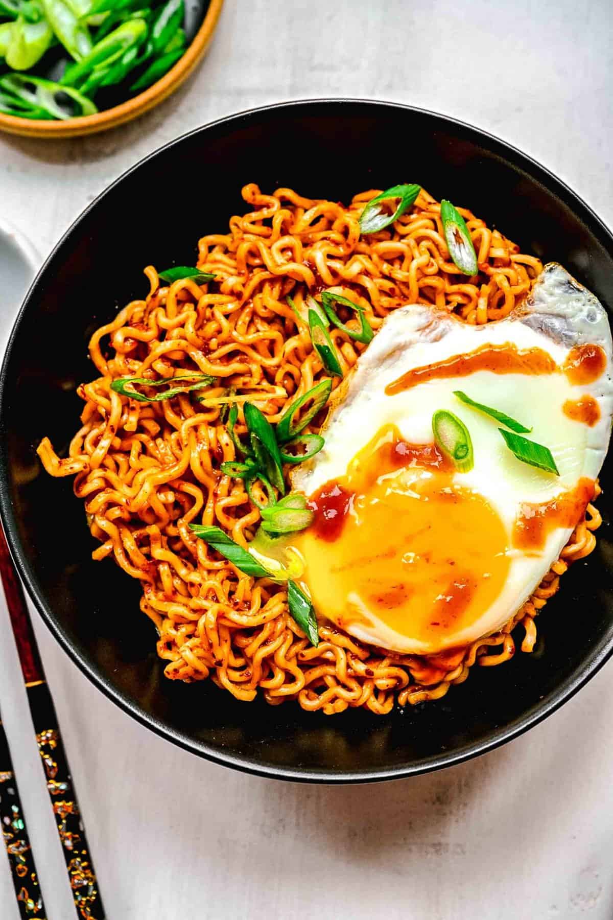 Buldak ramen served in a bowl with an egg.