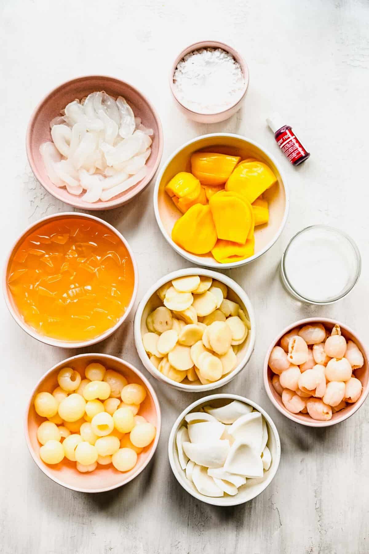 Ingredients for Chè Thái seperated into individual bowls.