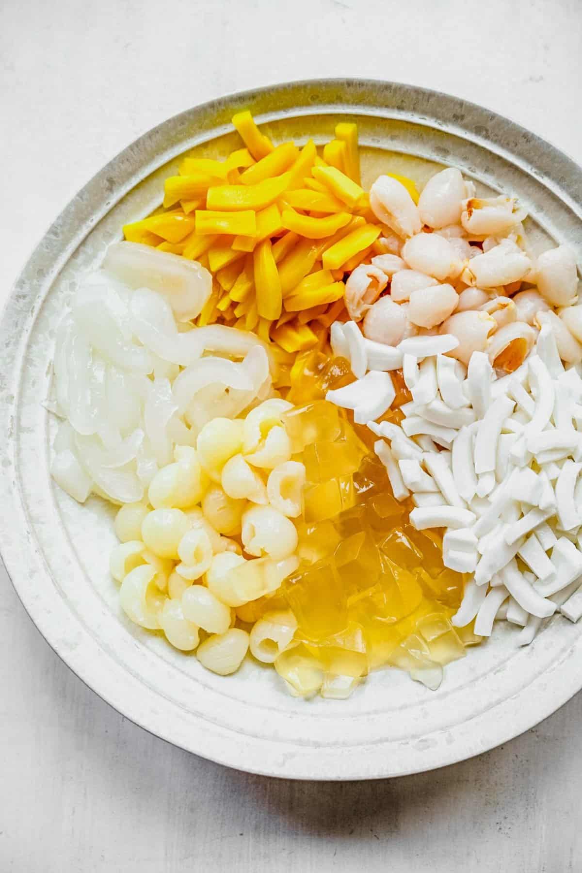 Tropical fruits in a bowl prepared for Chè Thái.