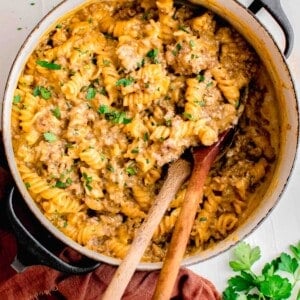 a large pot is filled with cooked cheeseburger pasta.