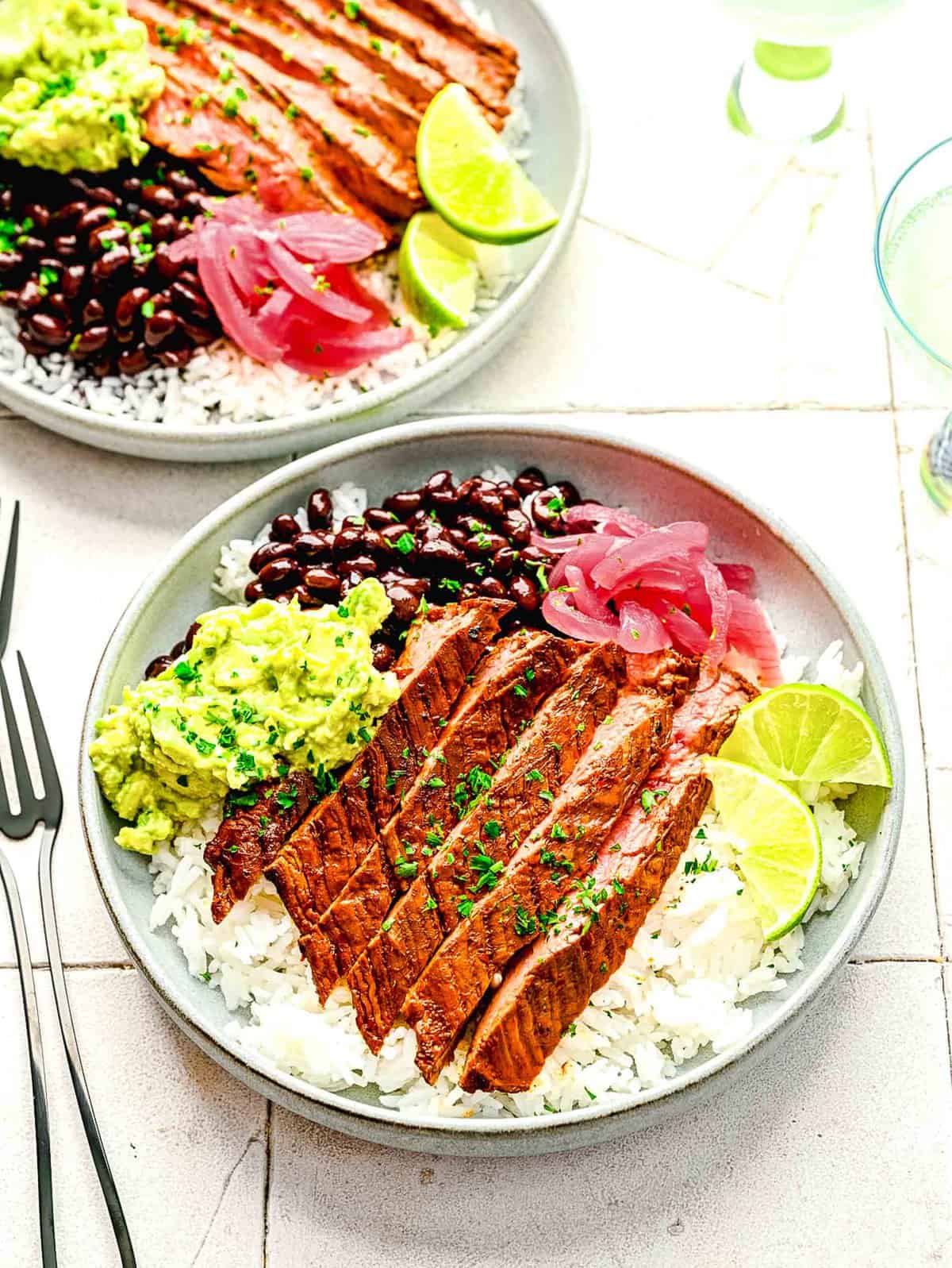 Garlic guajillo steak in burrito bowls.