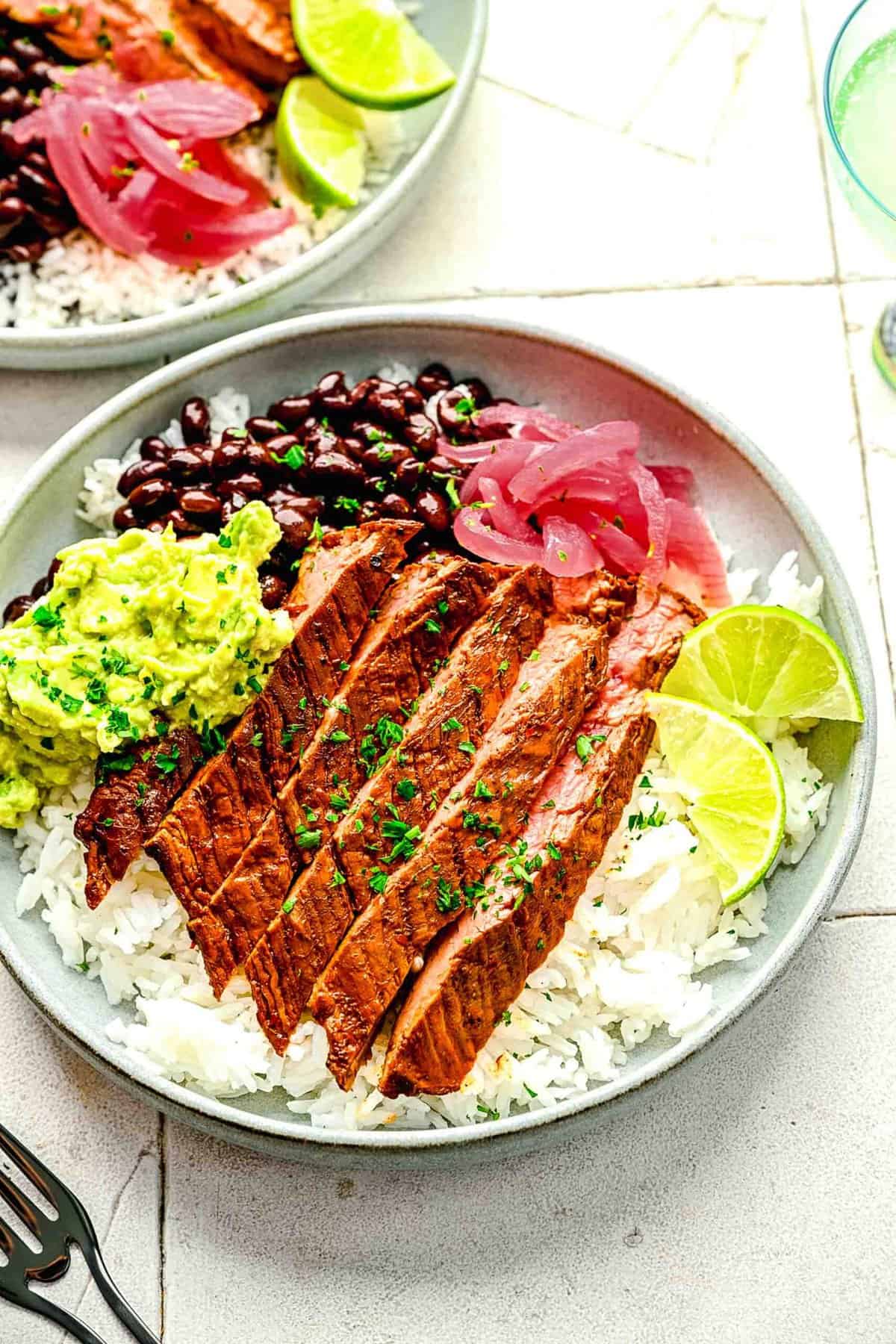 Garlic guajillo steak in burrito bowls.