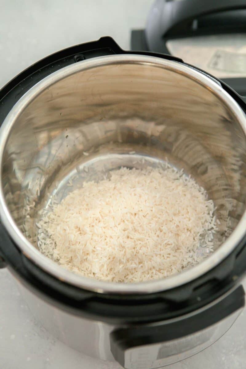 uncooked jasmine rice in the insert of instant pot