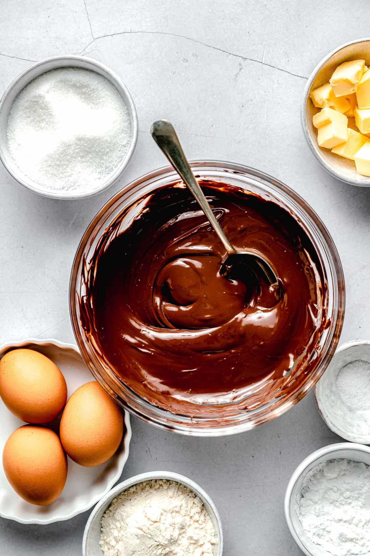 Ingredients for molten lava cake seperated into bowls.