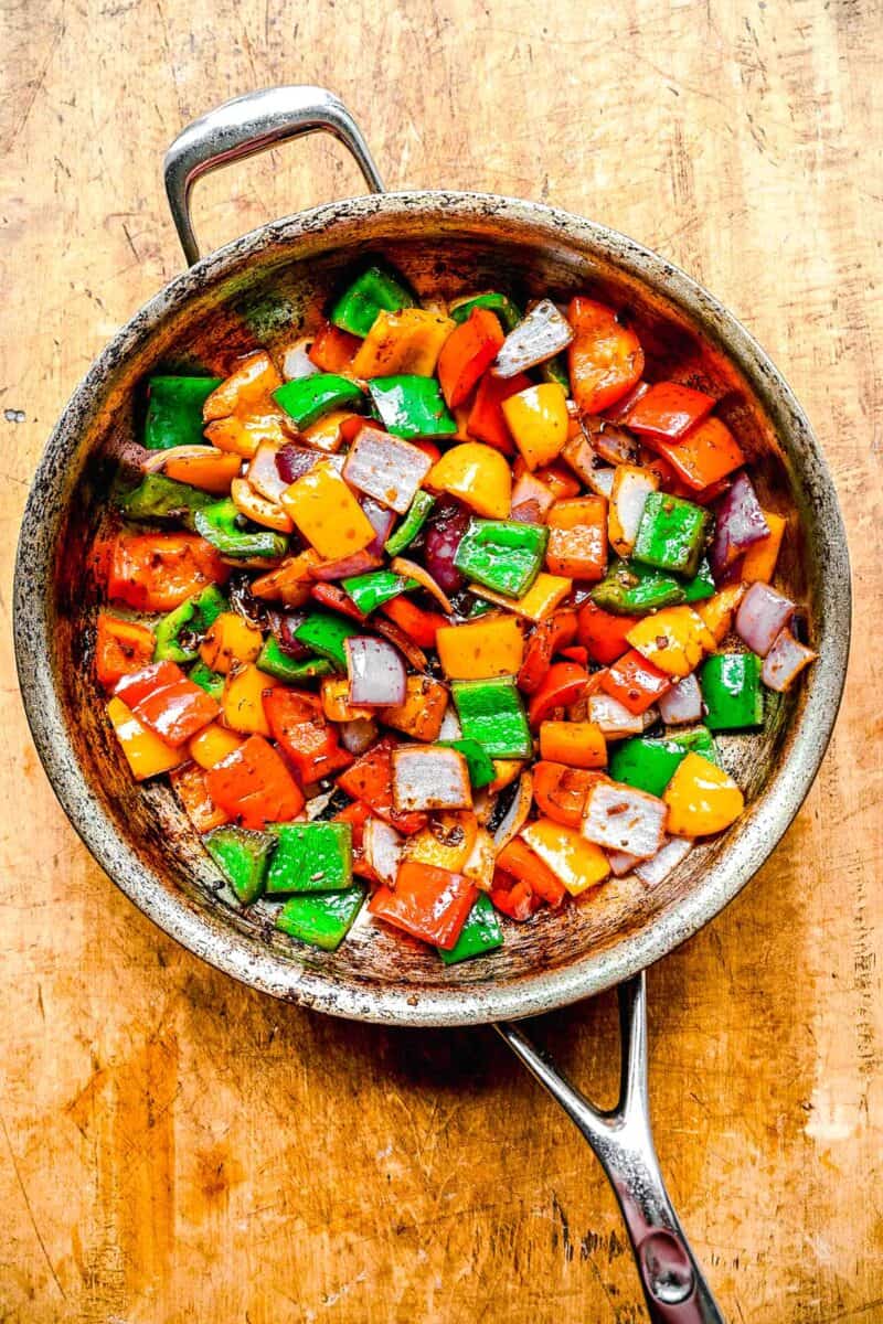 Sauteeing the vegetables for bo luc lac.