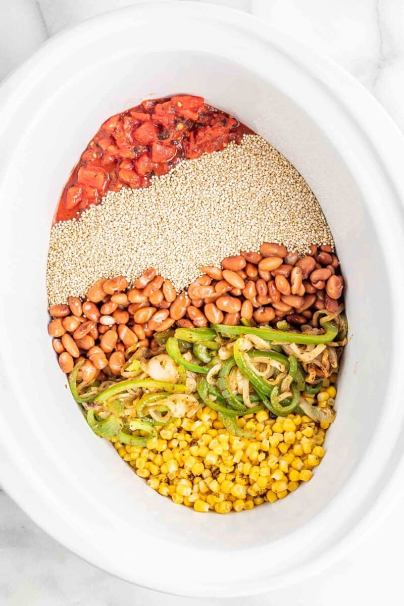several ingredients are lined up next to each other in a white Crockpot.