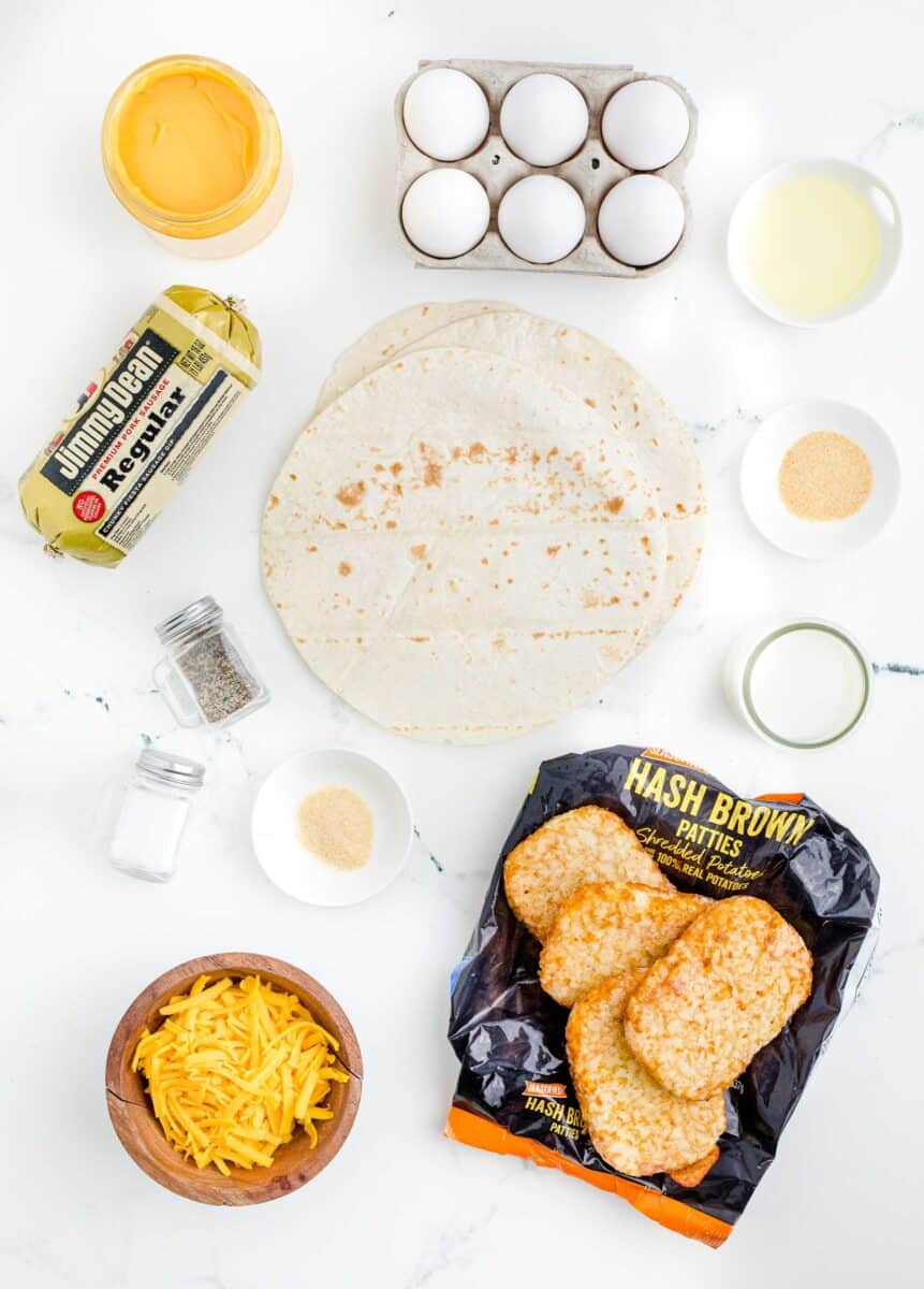 the ingredients for breakfast crunchwraps are placed on a white surface.