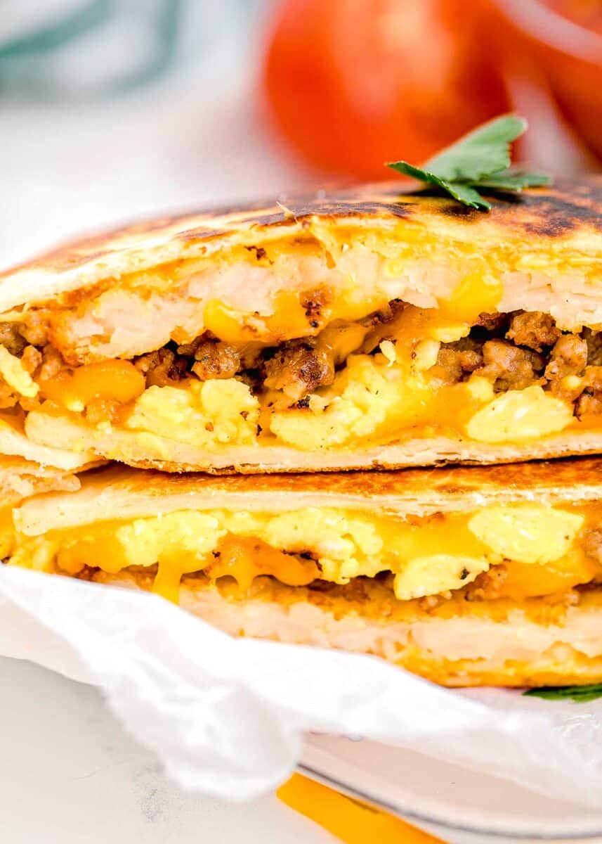 halved crunchwraps are stacked on top of one another.