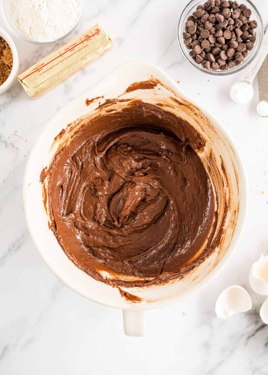 brownie batter has been mixed in a large bowl.