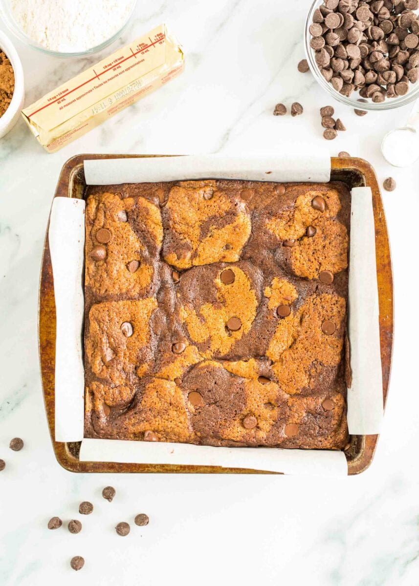 baked brookies are presented in a square baking dish.