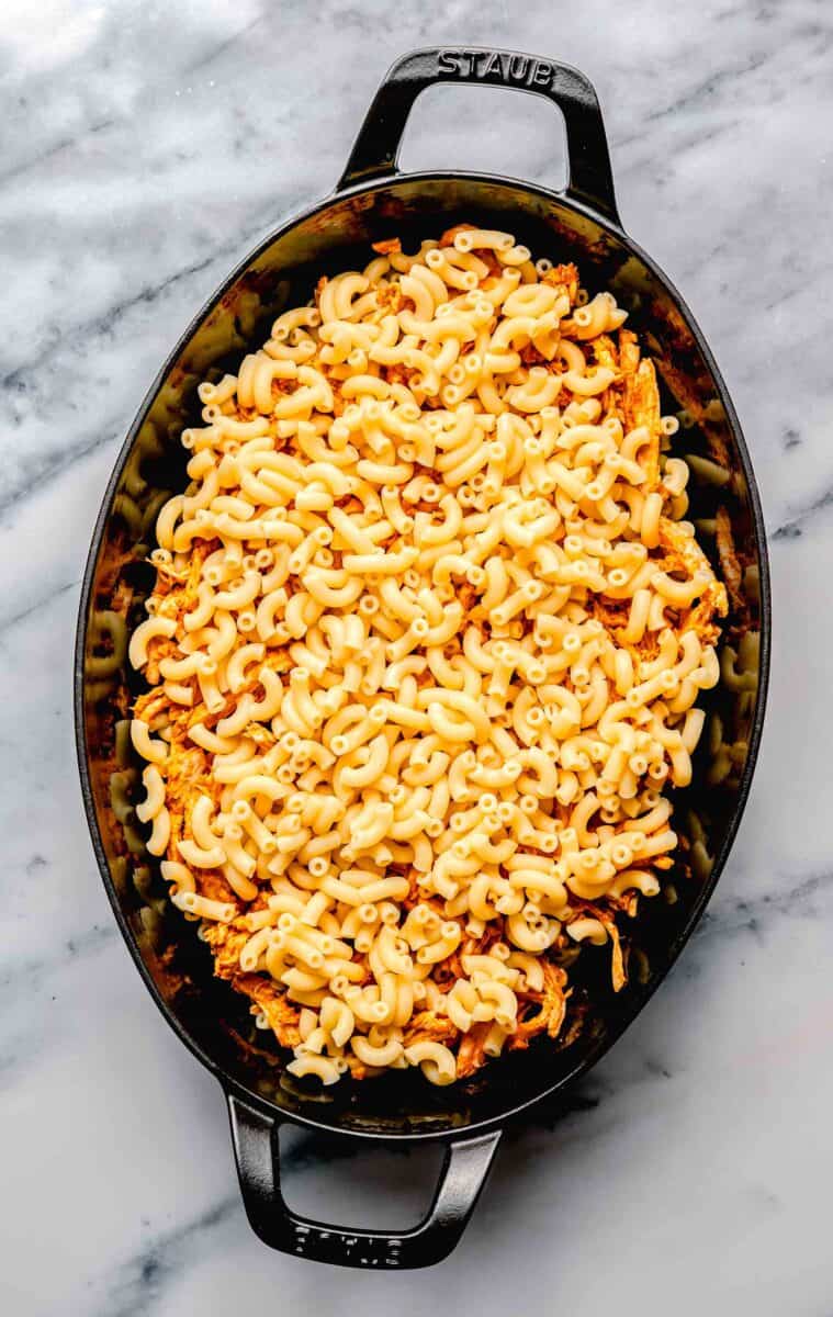 noodles are placed in a large baking dish.