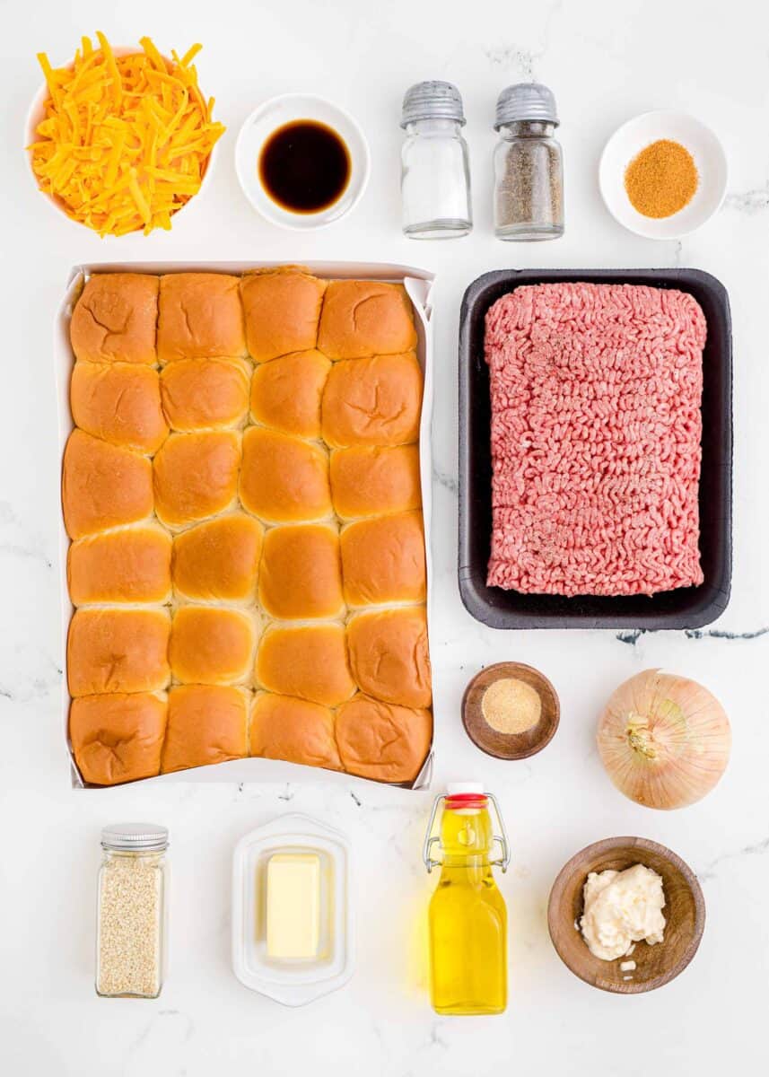 the ingredients for sliders are placed on a countertop.
