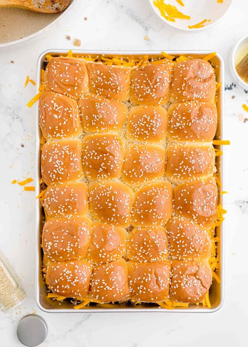 bread rolls have been topped with sesame seeds.