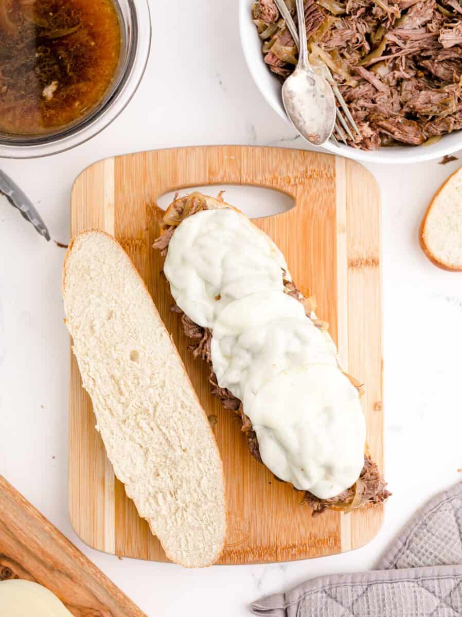 a french dip sandwich is halved.