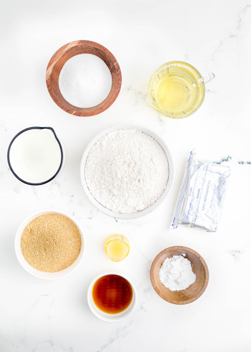 the ingredients for fried cheesecake bites are placed on a countertop.