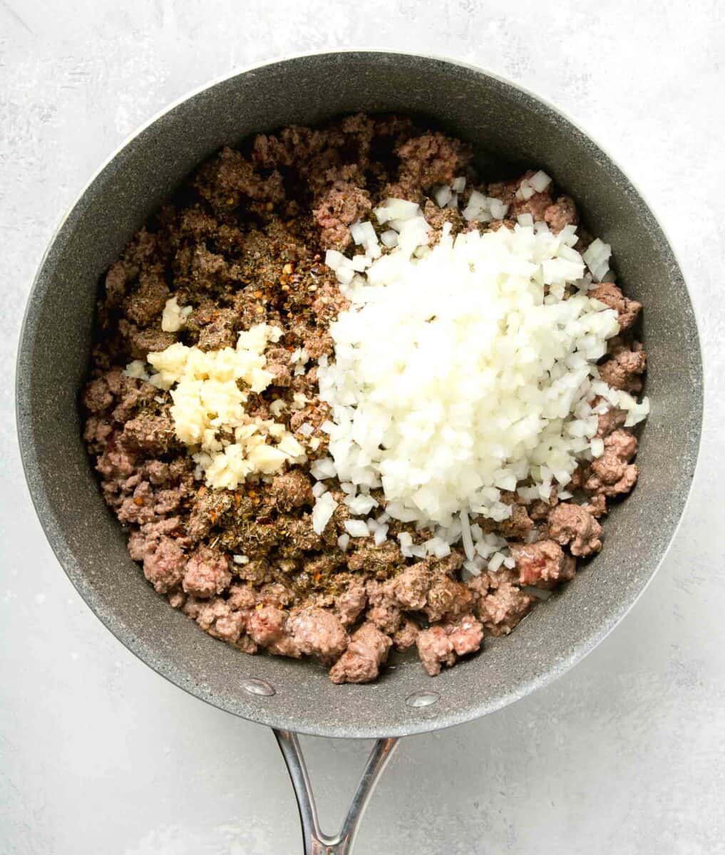onions, garlic, and seasonings added to the cook ground beef in nonstick skillet