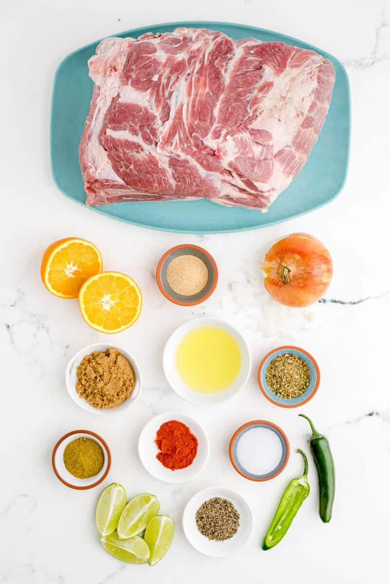 the ingredients for slow cooker pork are placed on a white surface.