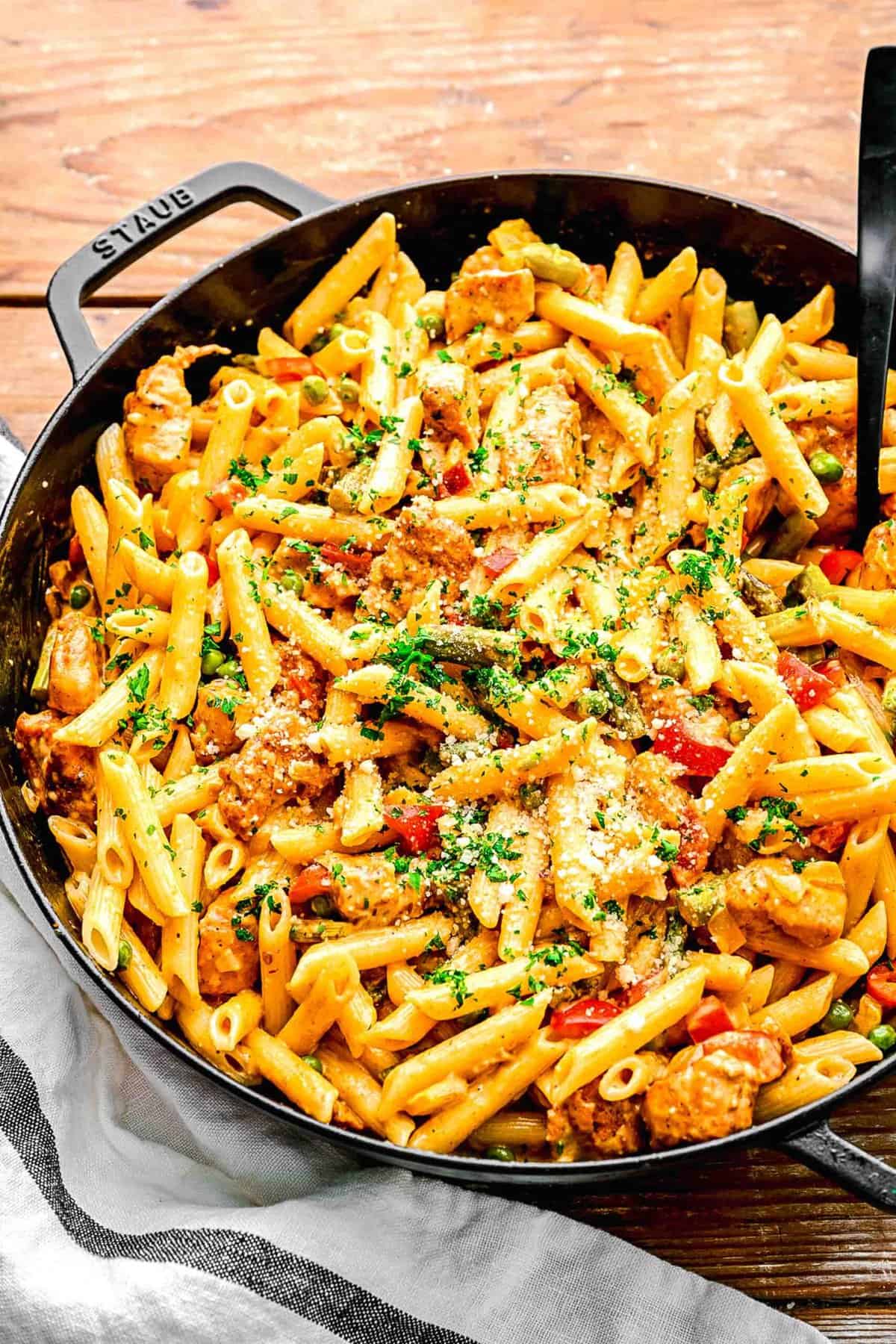 Spicy chicken chipotle pasta in a pan with a fork.