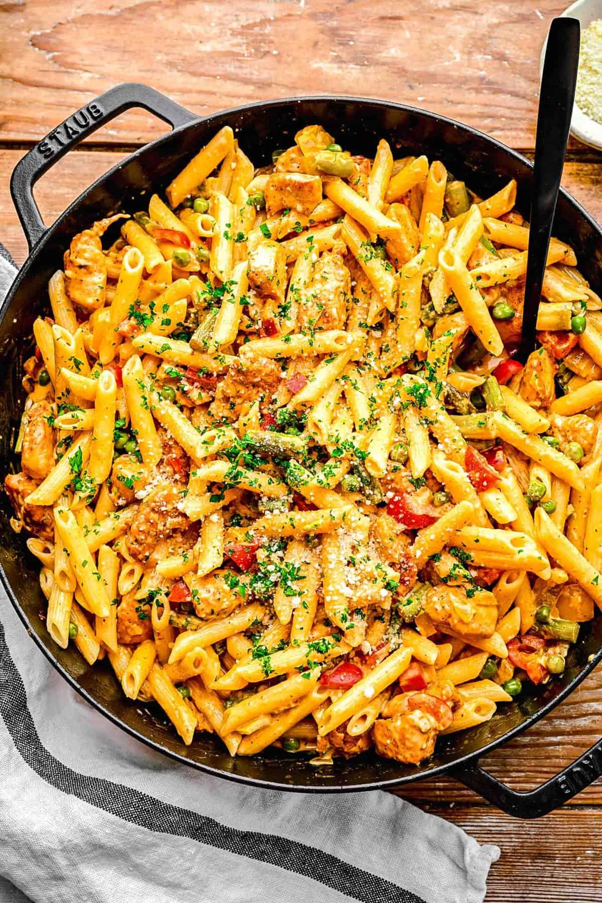 Spicy chicken chipotle pasta in a pan with a fork.