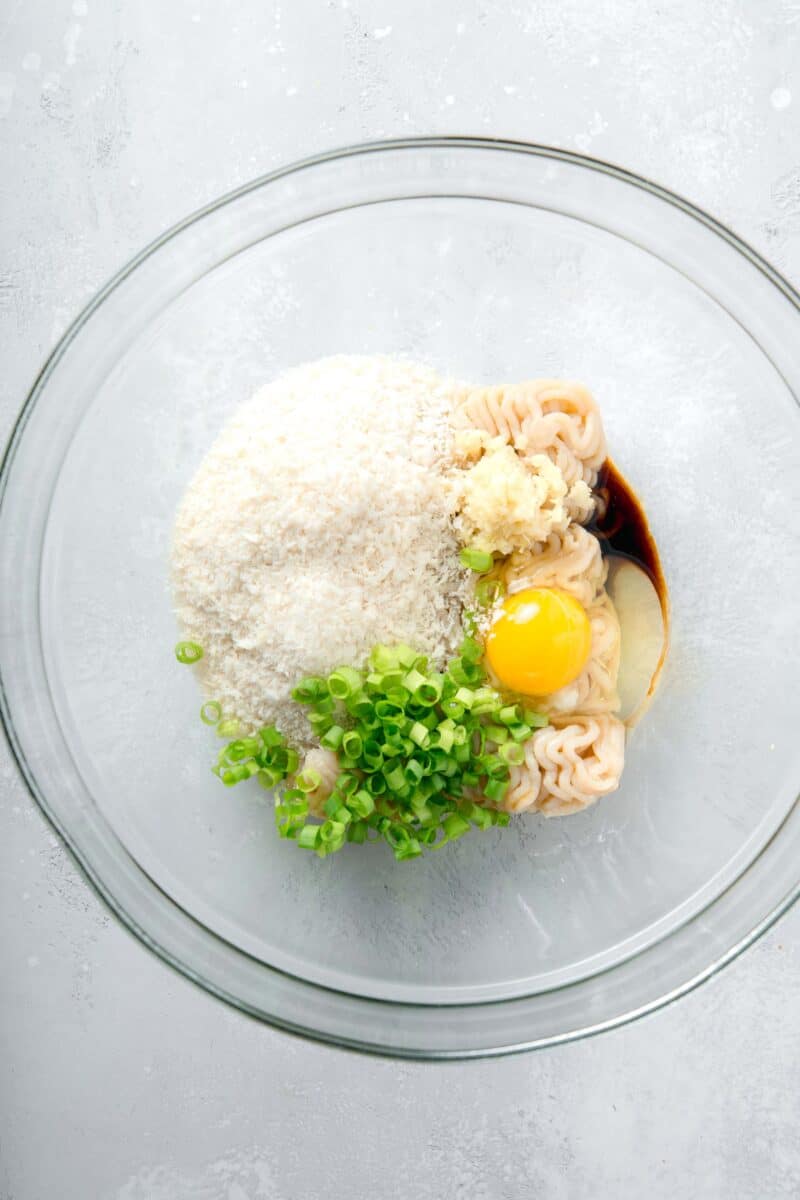 ingredients for teriyaki chicken meatballs in a large clear bowl