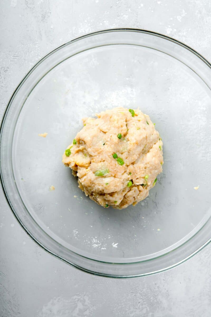 teriyaki chicken meatball mixture mixed together in a large clear bowl