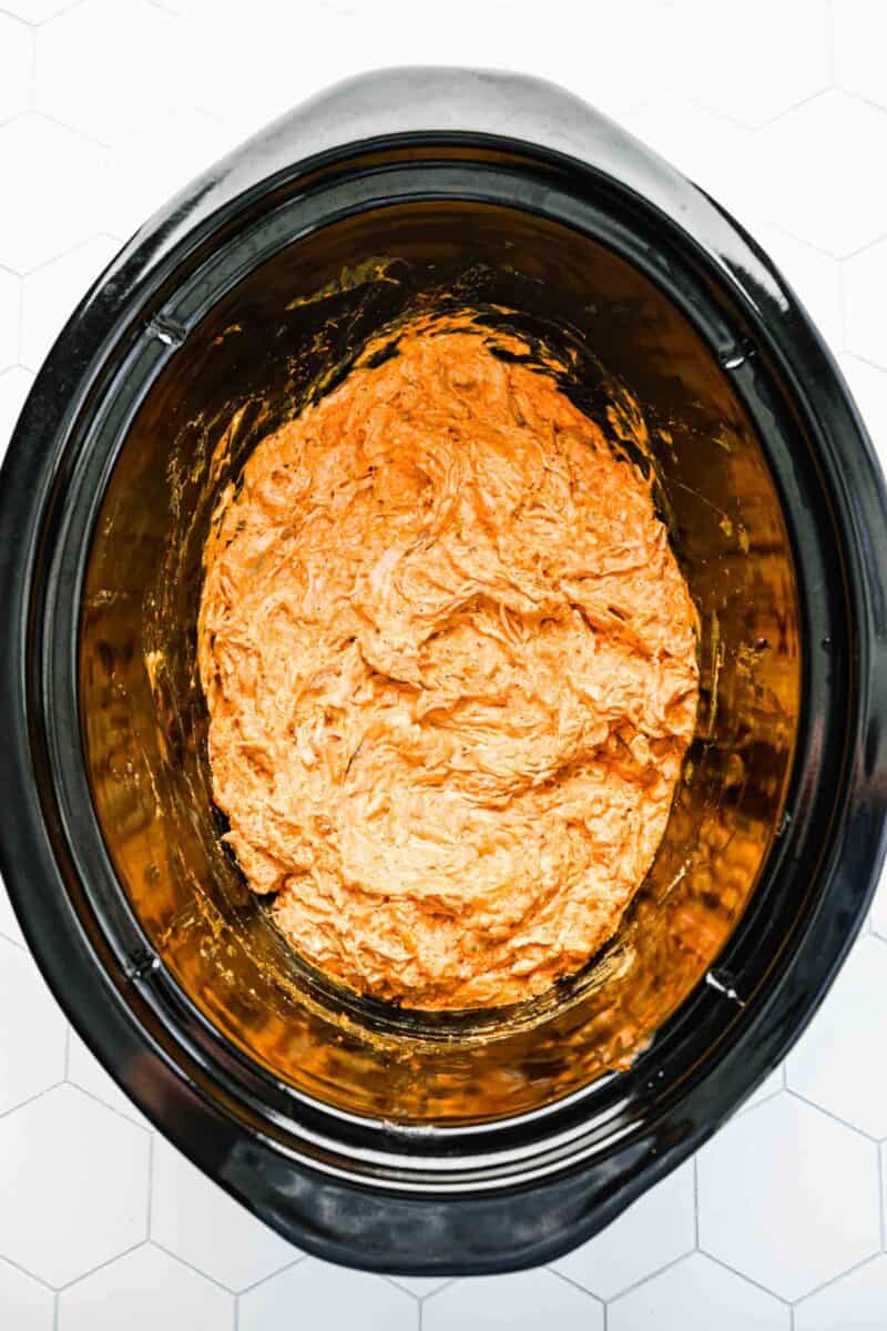 Buffalo chicken dip in a crockpot ready to be served.