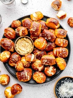 Pretzel bites on a plate with whole-grain mustard.