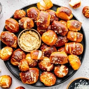 Pretzel bites on a plate with whole-grain mustard.