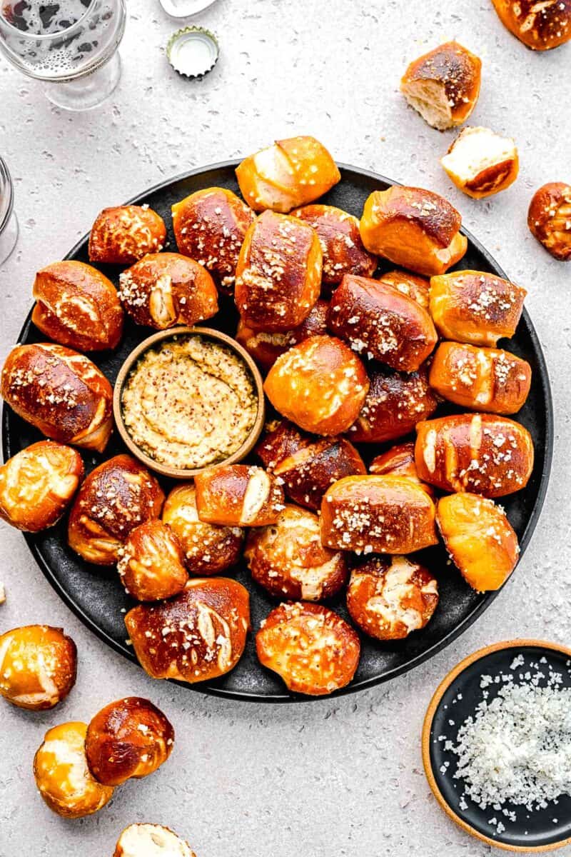 Pretzel bites on a plate with whole-grain mustard.