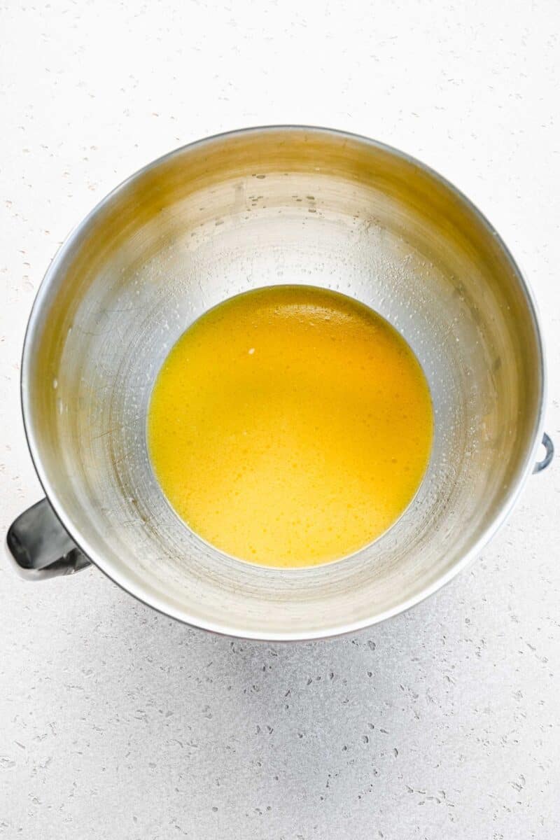 Wet ingredients for pretzels in a mixing bowl.