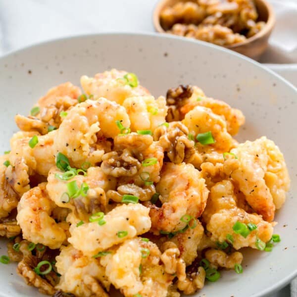 honey walnut shrimp in a large speckled bowl