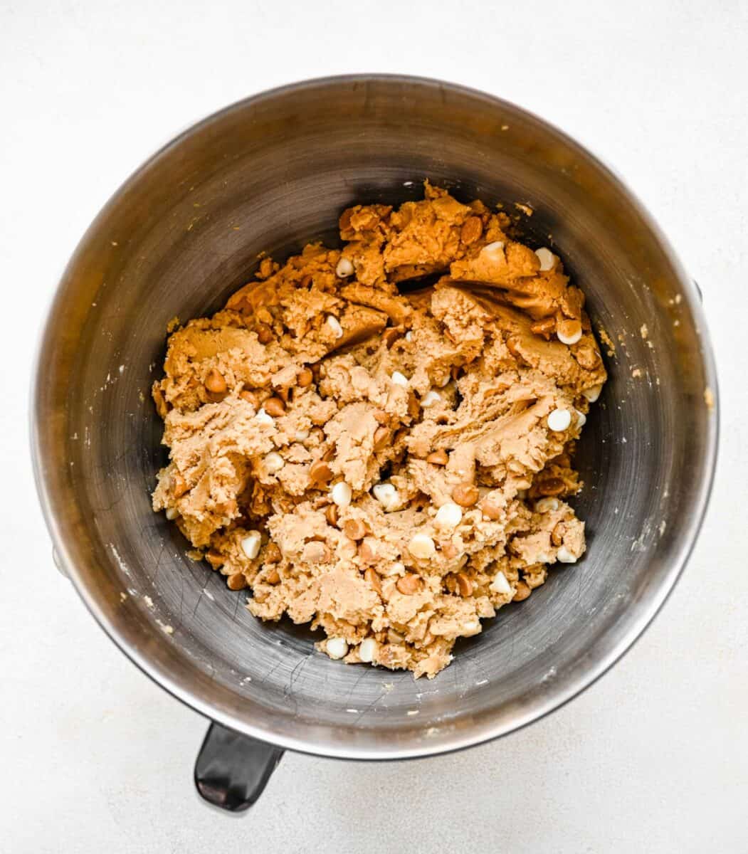 cookie bar dough is placed in a mixing bowl.