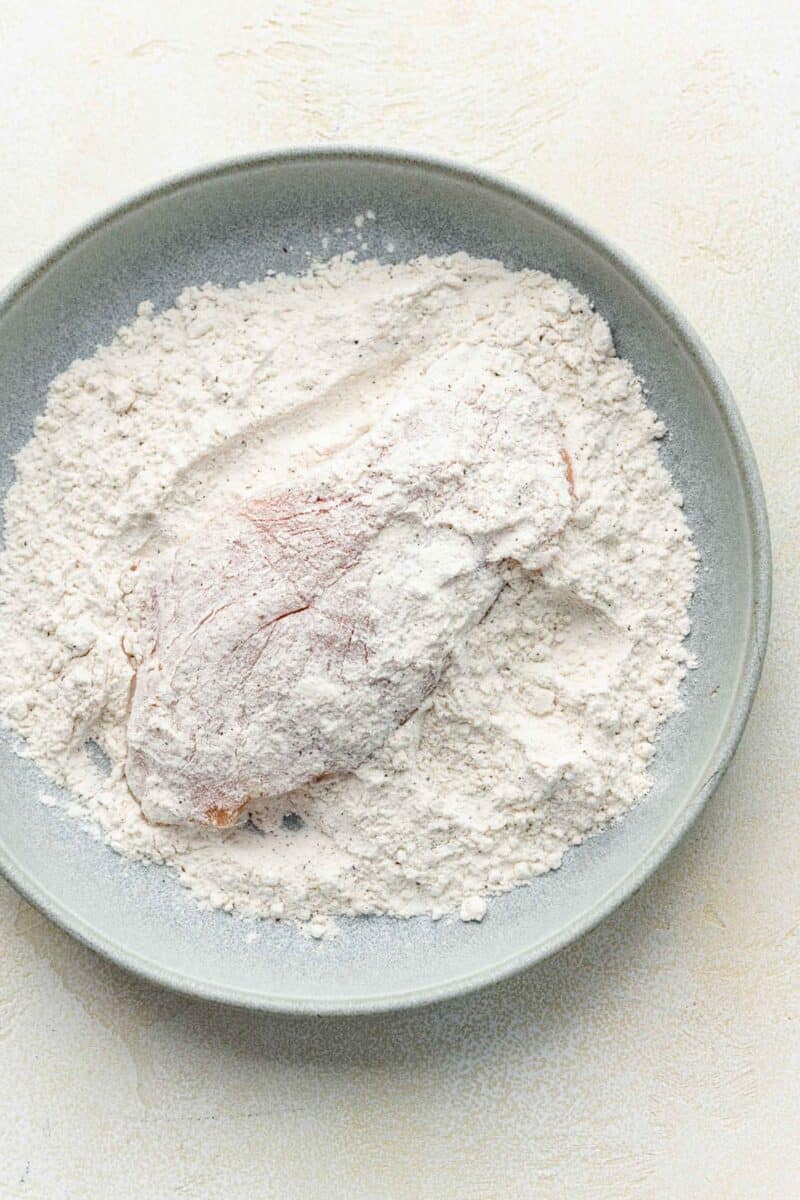 chicken is fully coated in flour