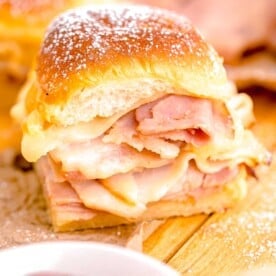 a monte cristo slider is presented on a wooden surface